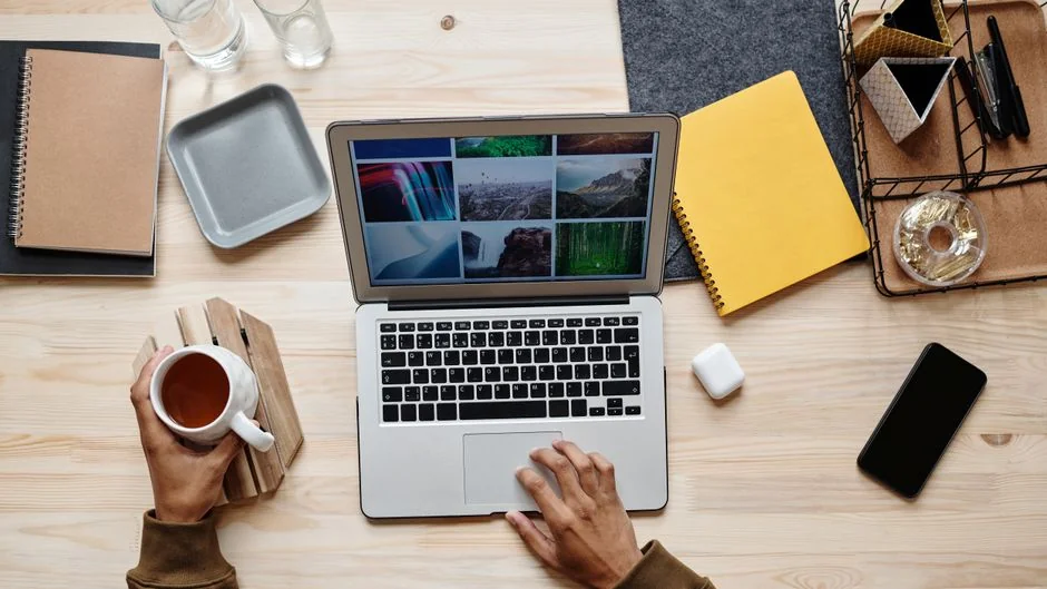 Group of designers collaborating in modern office space with computer.