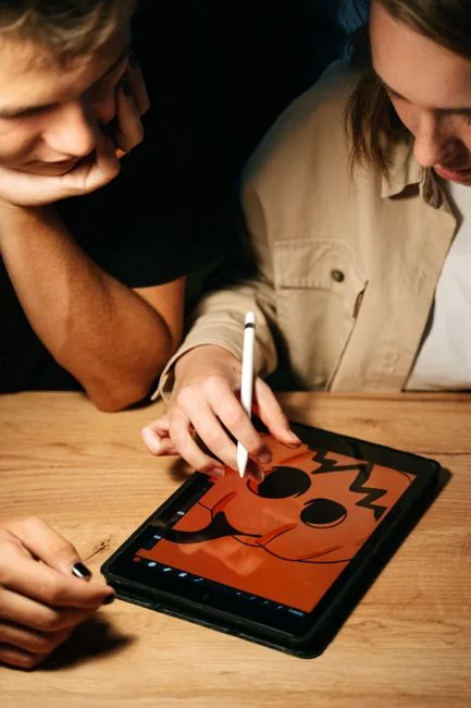 A focused designer works on a user-centric project in a modern office environment.
